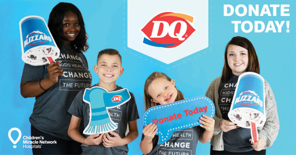 kids holding DQ signs
