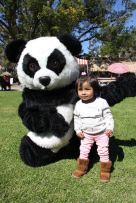 Panda Express mascot with former CHOC heart patient.