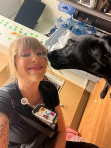 CHOC charge nurse Sarah Carey and Odessa from our Resident Dog and Pet Therapy Program