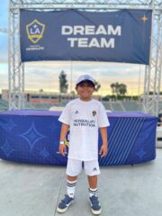 7-year-old Max, a young leukemia patient at CHOC, wearing a LA Galaxy jersey.
