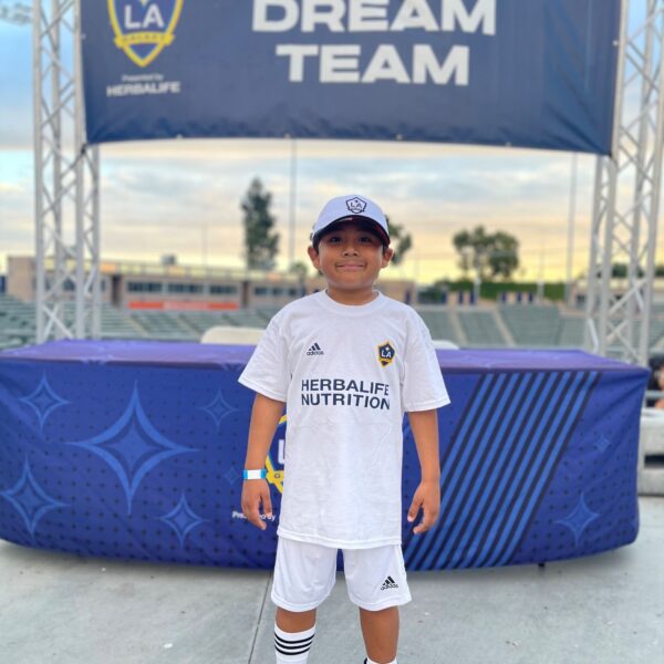 7-year-old Max, a young leukemia patient at CHOC, wearing a LA Galaxy jersey.