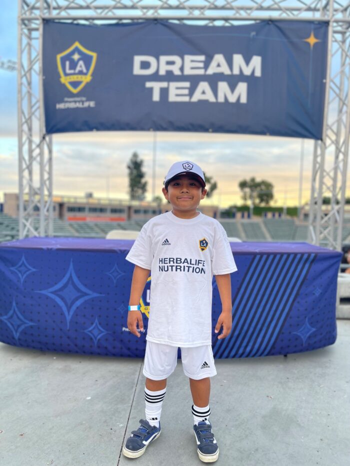 7-year-old Max, a young leukemia patient at CHOC, wearing a LA Galaxy jersey.