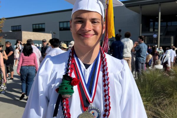 Grateful CHOC patient Carson in his graduation regalia