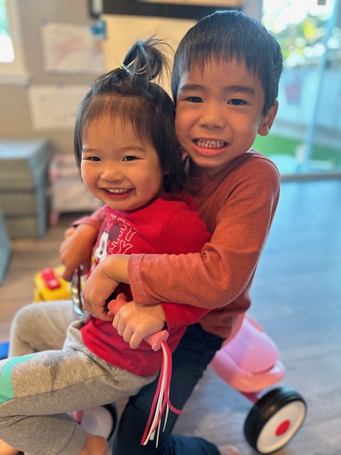 Emmett with his sister, smiling together