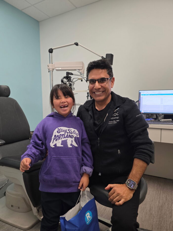 Kali pictured with Dr. Rahul Bhola, medical director and chief of the ophthalmology division at Rady Children's. 